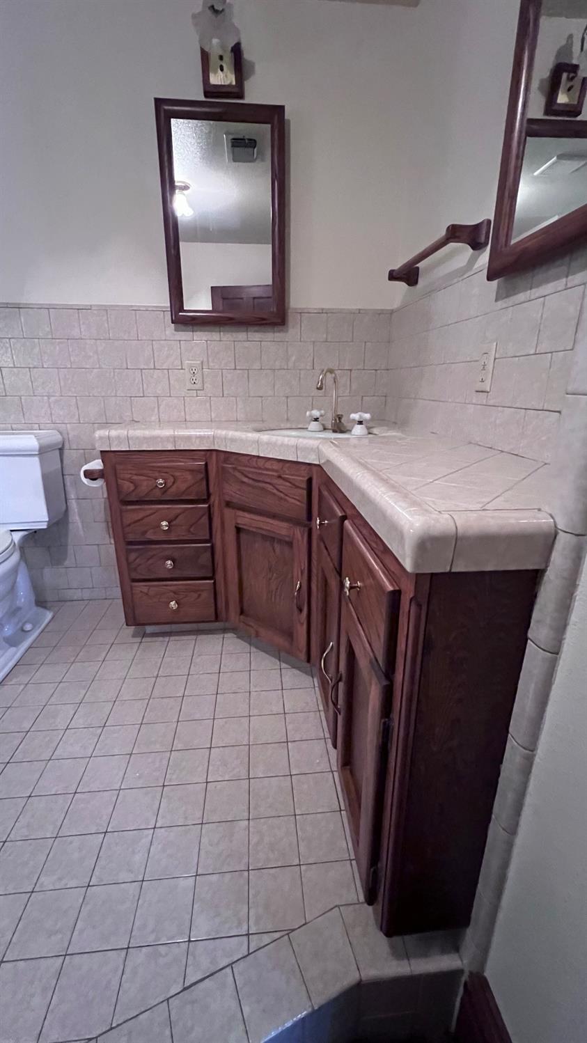 6375 Murphy Avenue Laton, CA 93242 - Photo 18 of 68 a bathroom with a sink and a mirror