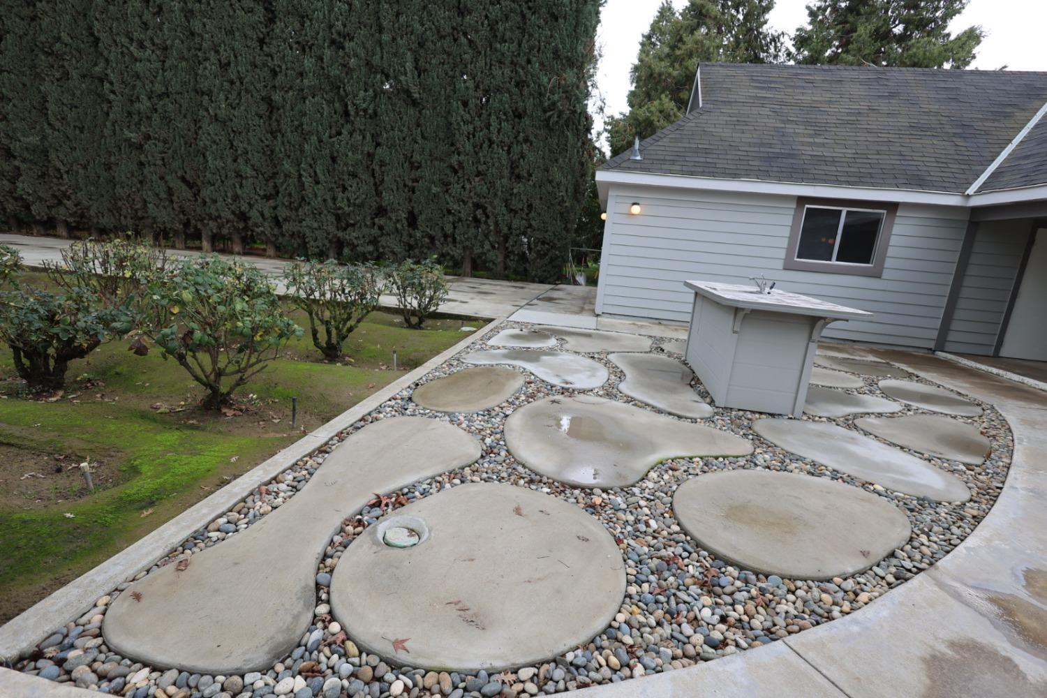 6375 Murphy Avenue Laton, CA 93242 - Photo 34 of 68 a backyard of a house with yard and outdoor seating