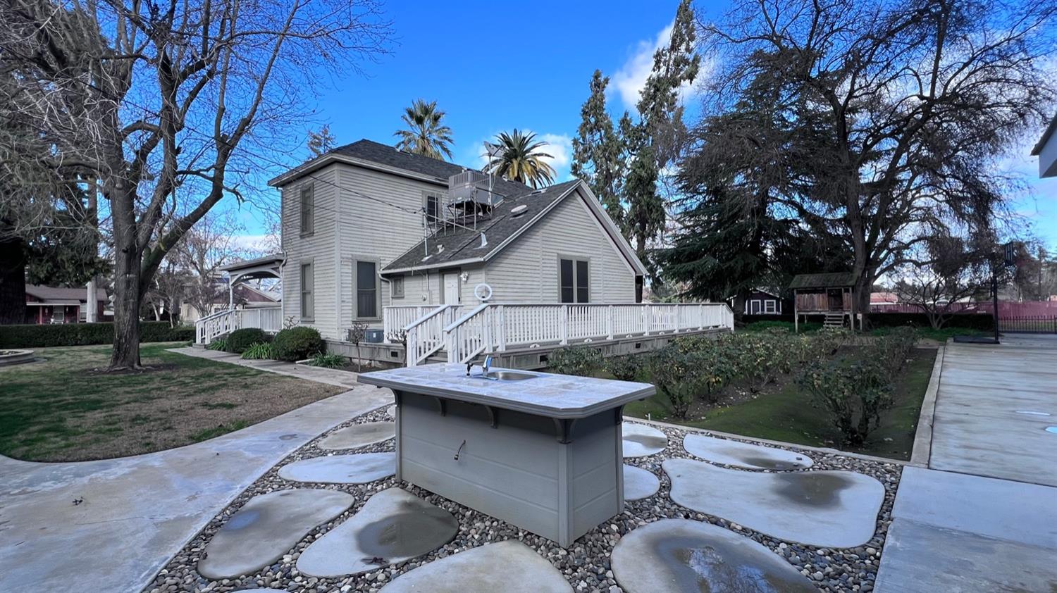 6375 Murphy Avenue Laton, CA 93242 - Photo 40 of 68 a view of a patio with table and chairs and a barbeque with potted plants