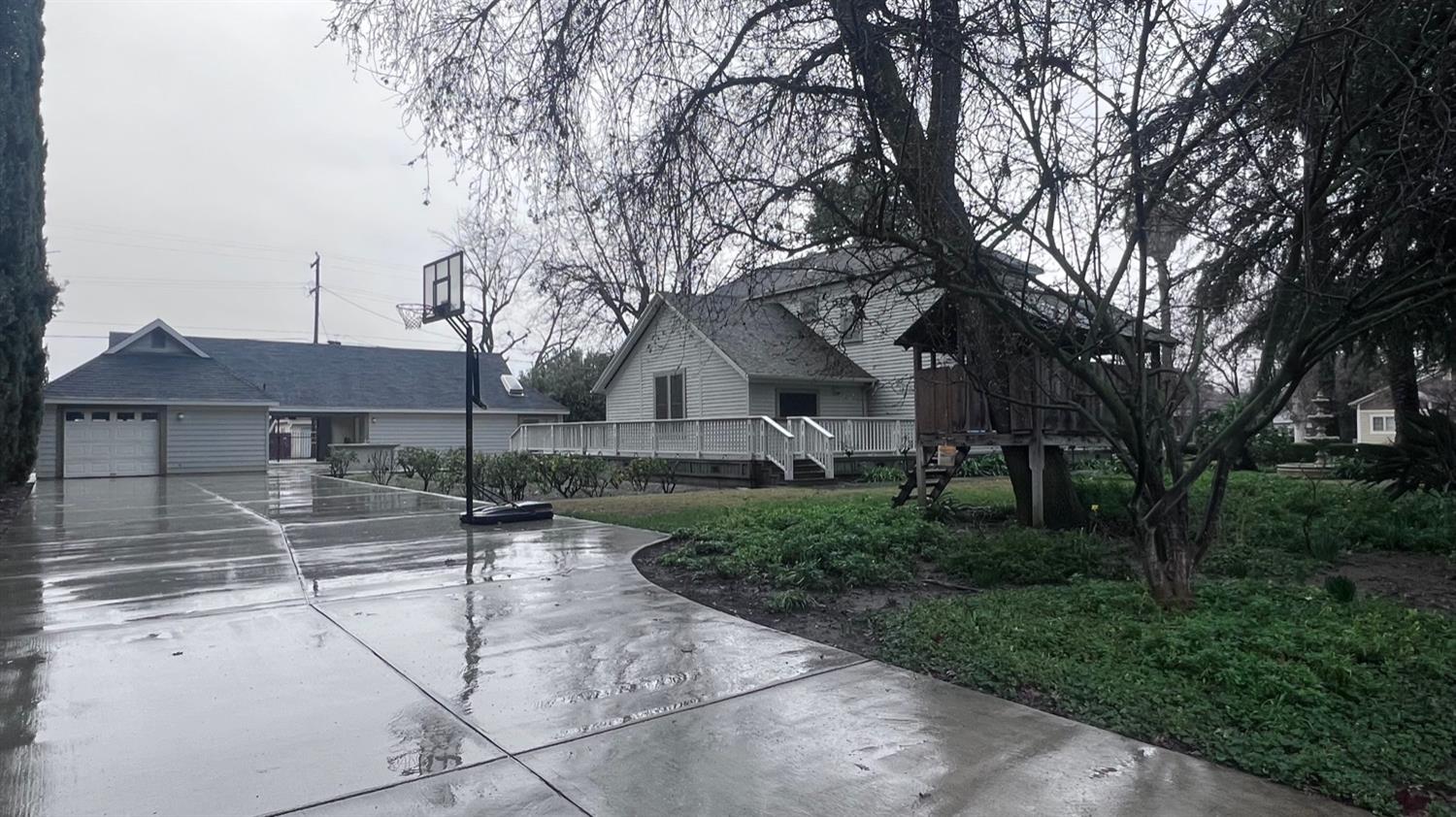 6375 Murphy Avenue Laton, CA 93242 - Photo 50 of 68 a view of a white house with a large tree