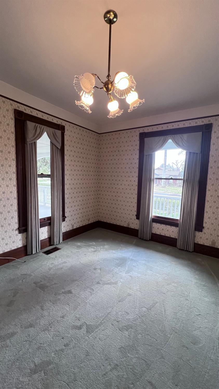 6375 Murphy Avenue Laton, CA 93242 - Photo 8 of 68 a view of an empty room with chandelier fan and window