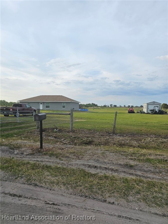 565 Stephens Road Wauchula, FL 33873 - Photo 2 of 36 a view of a lake with a big yard