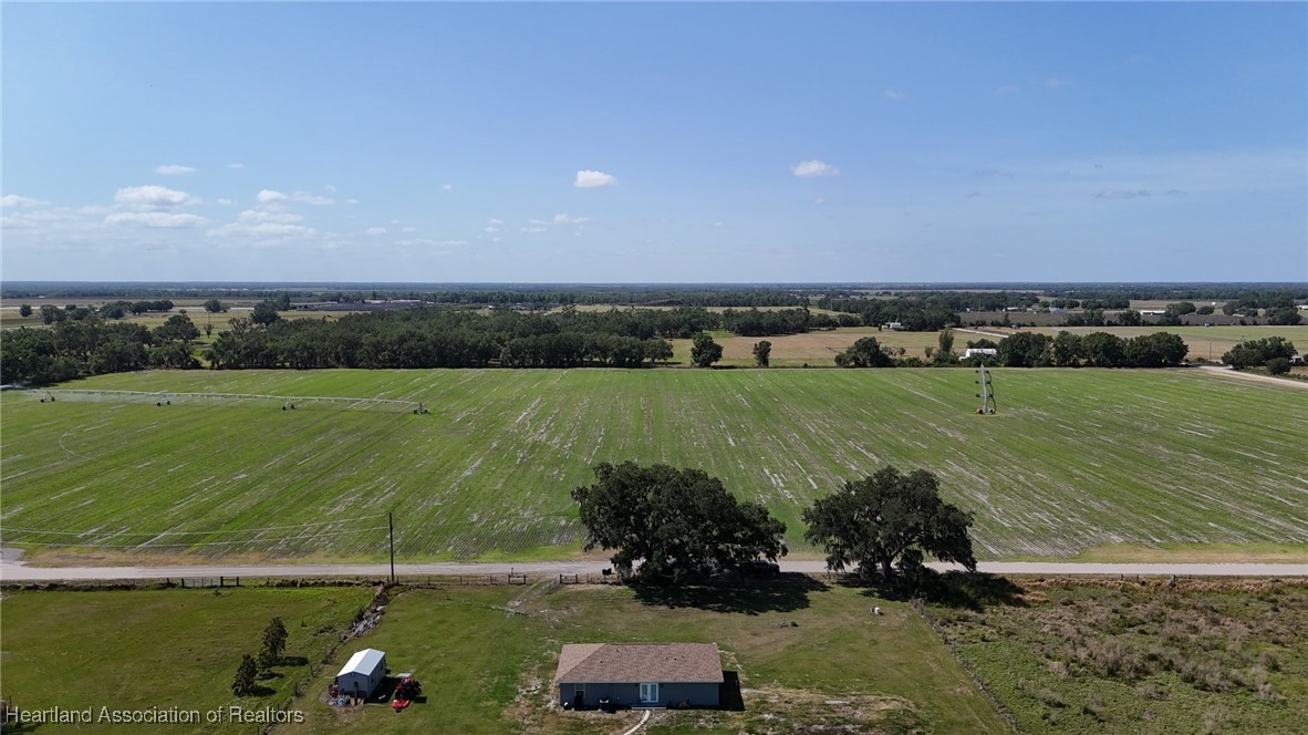 565 Stephens Road Wauchula, FL 33873 - Photo 22 of 36 a view of a water with a large building in the background