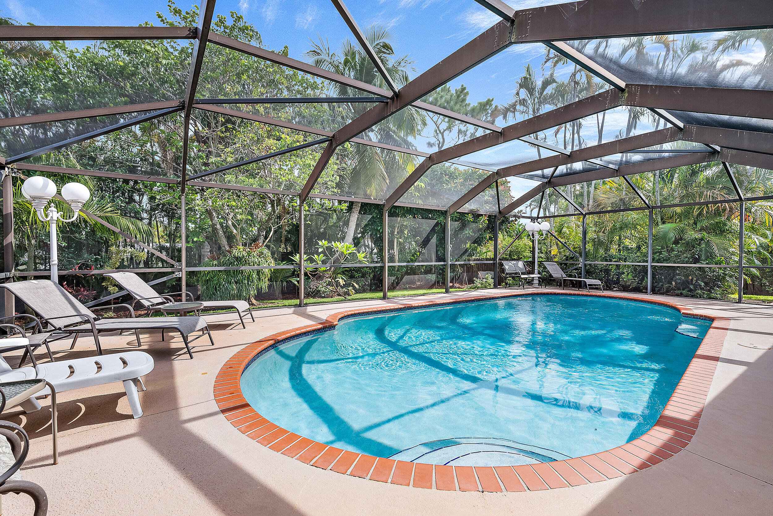 4755 Southeast Manatee Terrace Stuart, FL 34997 - Photo 3 of 24 Screened in Pool