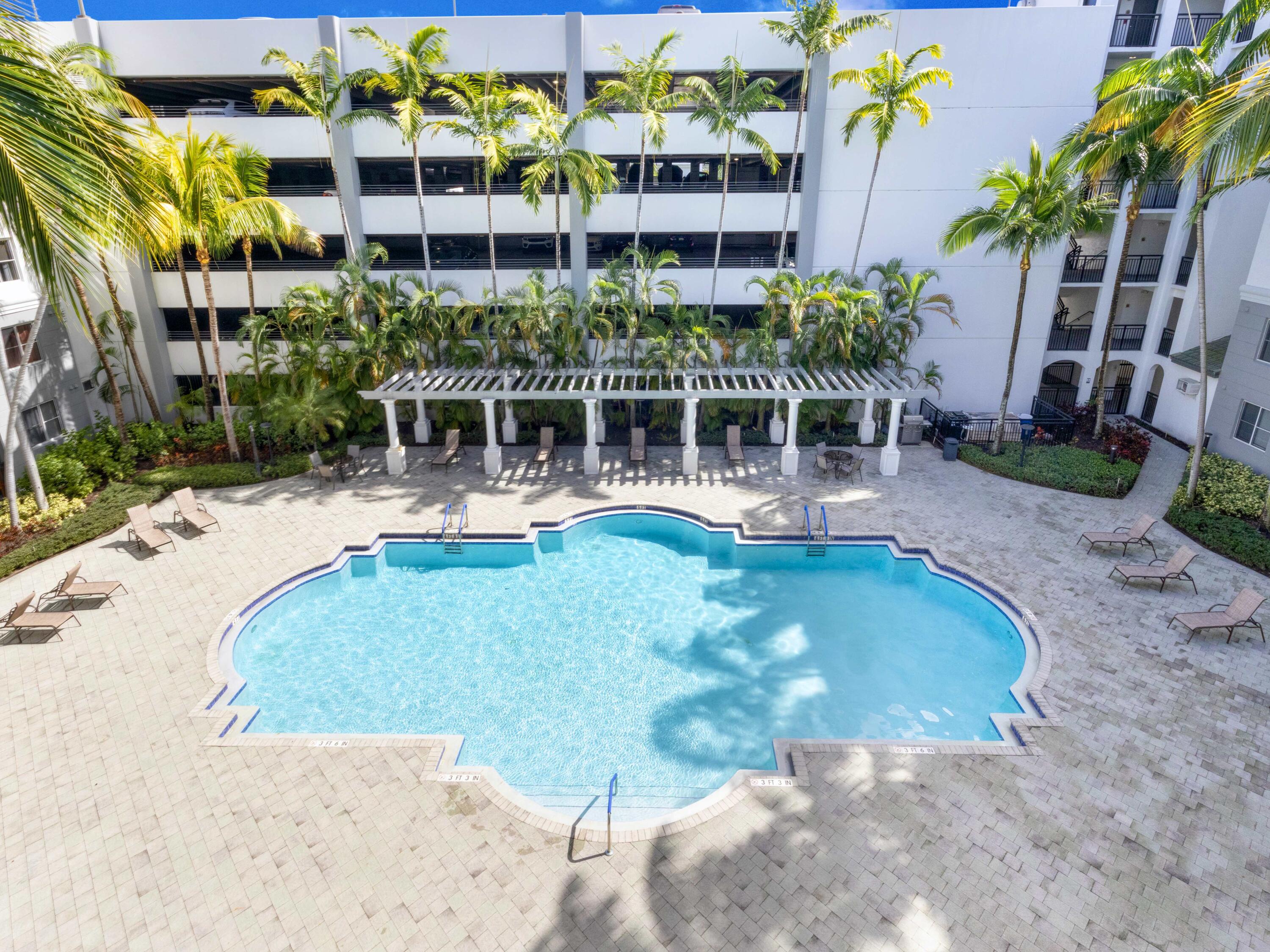 1690 Renaissance Commons Boulevard, Unit 1412 Boynton Beach, FL 33426 - Photo 31 of 42 Building Pool from Unit Floor