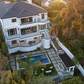 a aerial view of a house with a yard