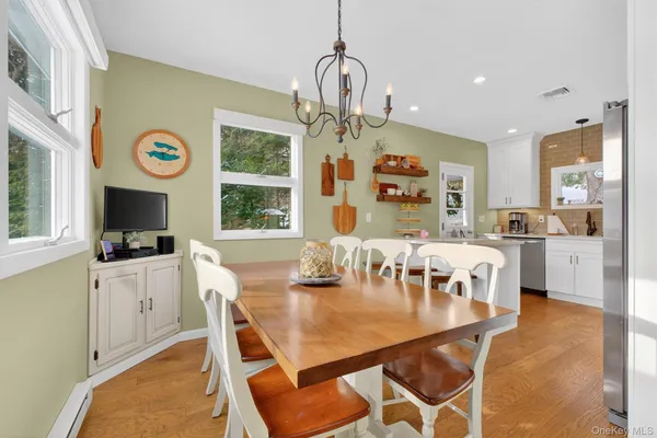 a view of a dining room with furniture window and outside view