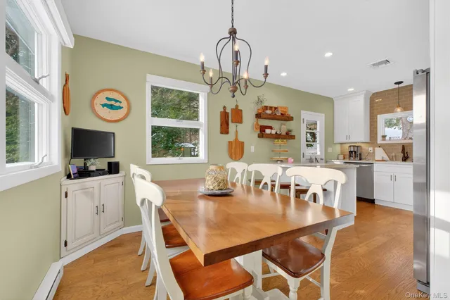 a view of a dining room with furniture window and outside view