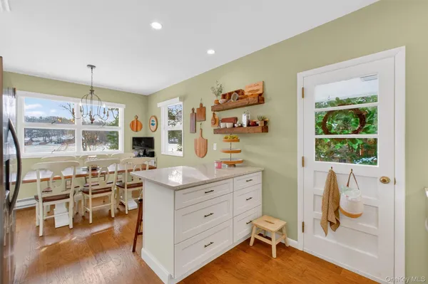a room with a wooden floor and furniture