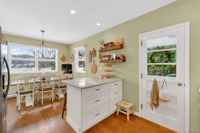 a room with a wooden floor and furniture