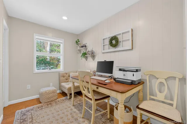 a workspace with furniture and window