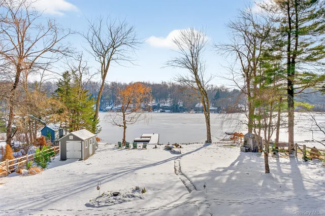 a view of a lake with boats and trees