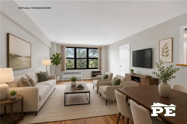 a living room with furniture wooden floor and a flat screen tv