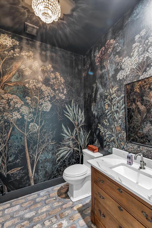 22 Samaritan Way Waco, TX 76705 - Photo 15 of 38 a bathroom with a toilet sink and mirror