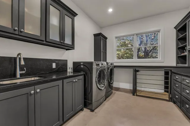 a utility room with cabinets
