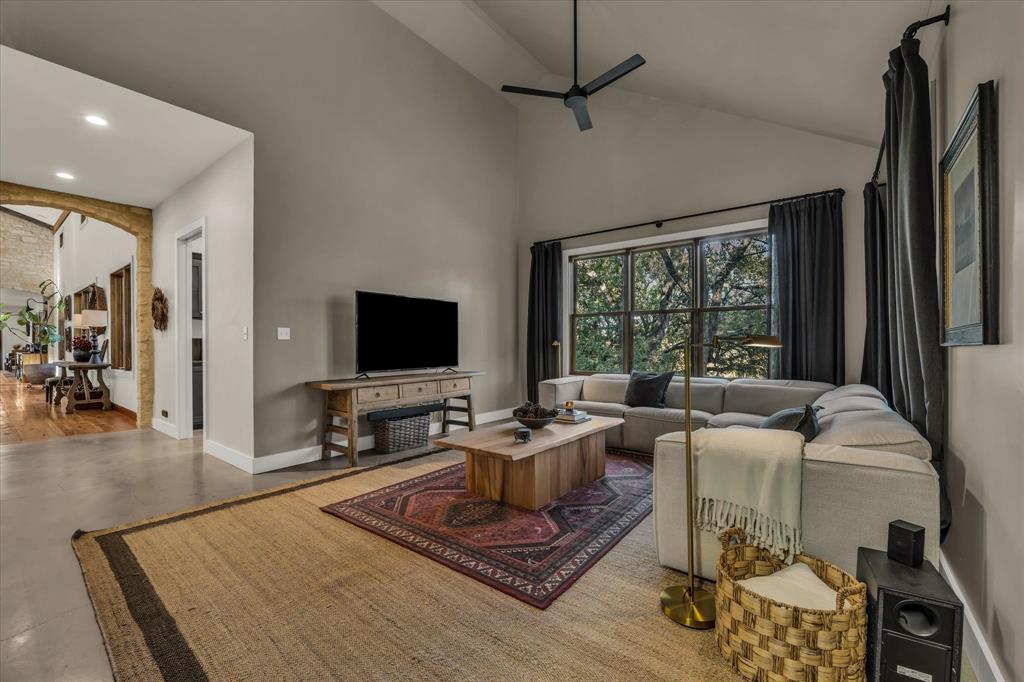 22 Samaritan Way Waco, TX 76705 - Photo 24 of 38 a living room with furniture a flat screen tv and a large window