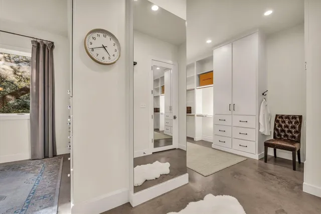 a spacious bathroom with a glass shower door
