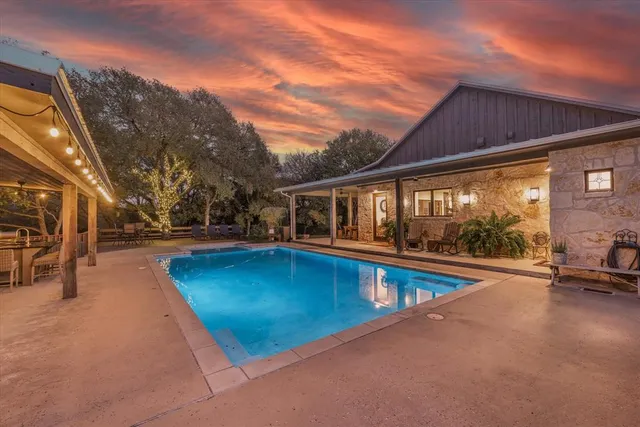a view of swimming pool with outdoor seating