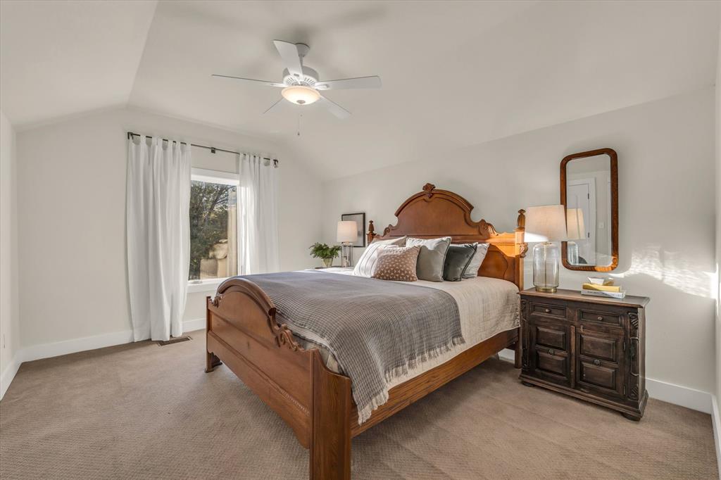 22 Samaritan Way Waco, TX 76705 - Photo 31 of 38 a spacious bedroom with a bed and a chandelier