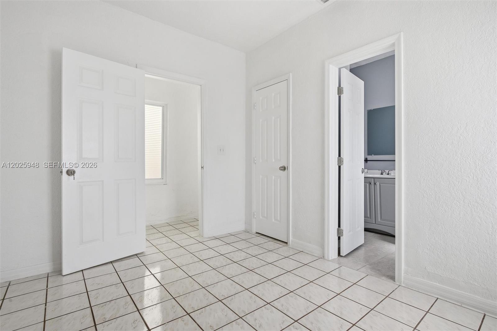 1745 Southwest 17th Street, Unit 2 Miami, FL 33145 - Photo 21 of 32 a view of an empty room and window