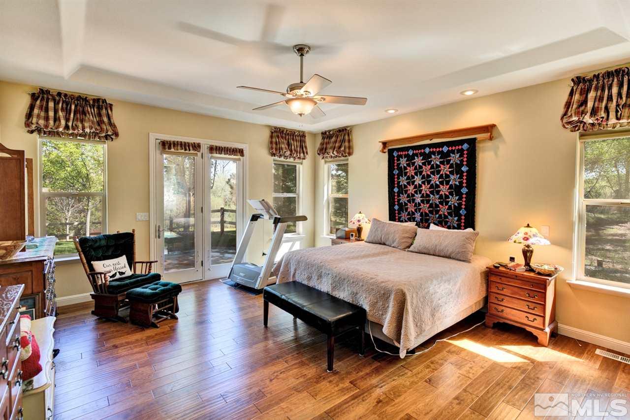 5610 Rivers Edge Drive Fallon, NV 89406 - Photo 16 of 25 a bedroom with a bed couch and a window