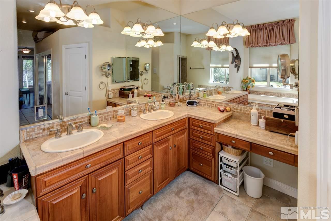 5610 Rivers Edge Drive Fallon, NV 89406 - Photo 18 of 25 a spacious bathroom with a double vanity sink mirror and a