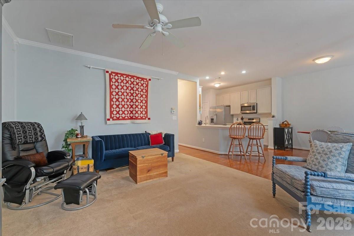 7948 Mariners Pointe Circle Denver, NC 28037 - Photo 16 of 39 a living room with furniture and a table