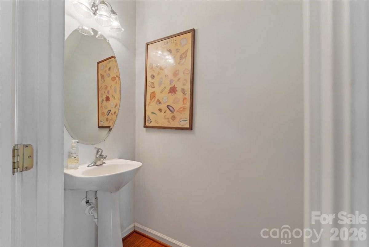 7948 Mariners Pointe Circle Denver, NC 28037 - Photo 17 of 39 a bathroom with a sink and a mirror