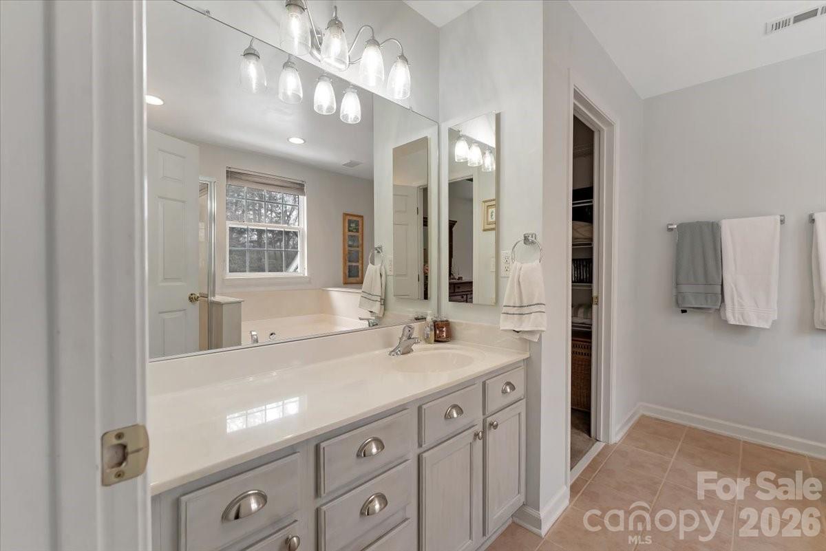 7948 Mariners Pointe Circle Denver, NC 28037 - Photo 24 of 39 a bathroom with a sink double vanity and a mirror