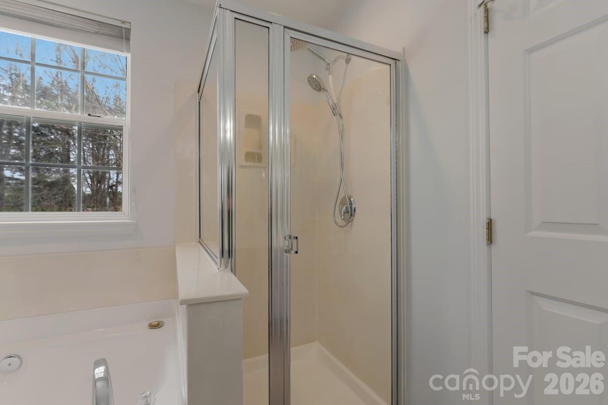 7948 Mariners Pointe Circle Denver, NC 28037 - Photo 26 of 39 a bathroom with a glass shower door
