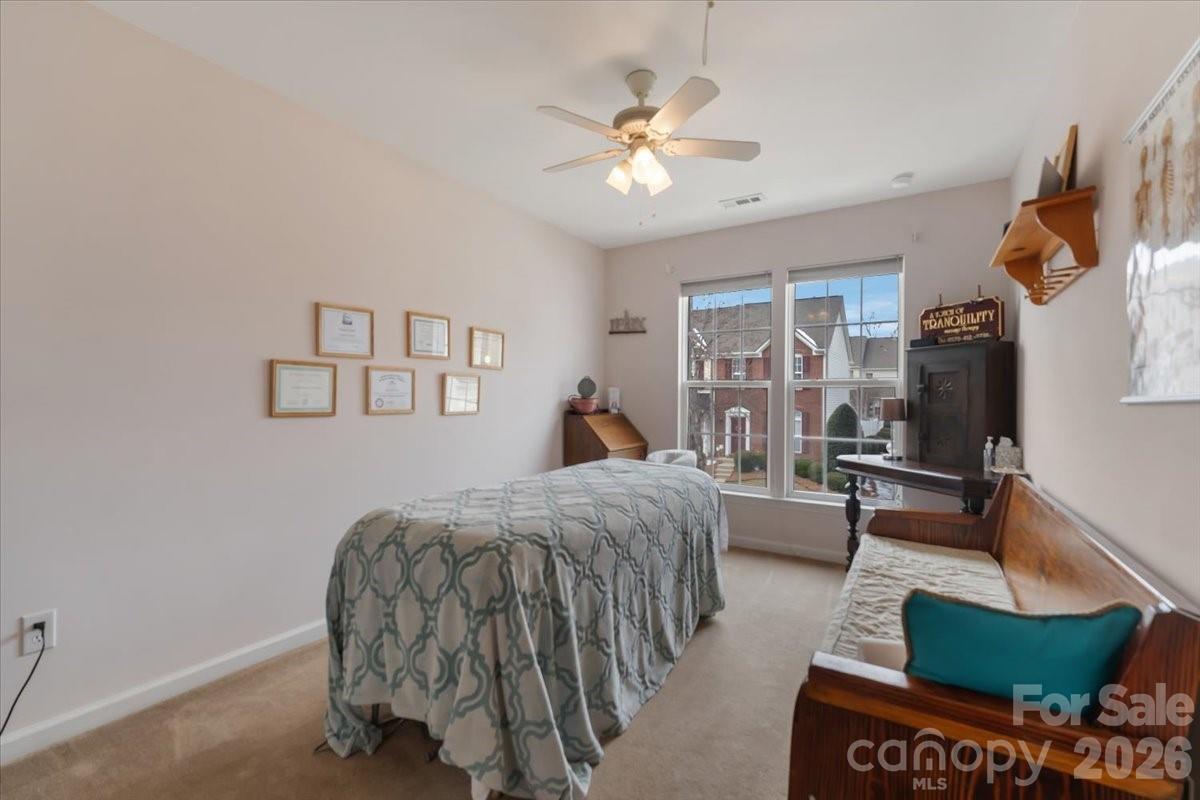 7948 Mariners Pointe Circle Denver, NC 28037 - Photo 27 of 39 a bed room with a bed and a couch