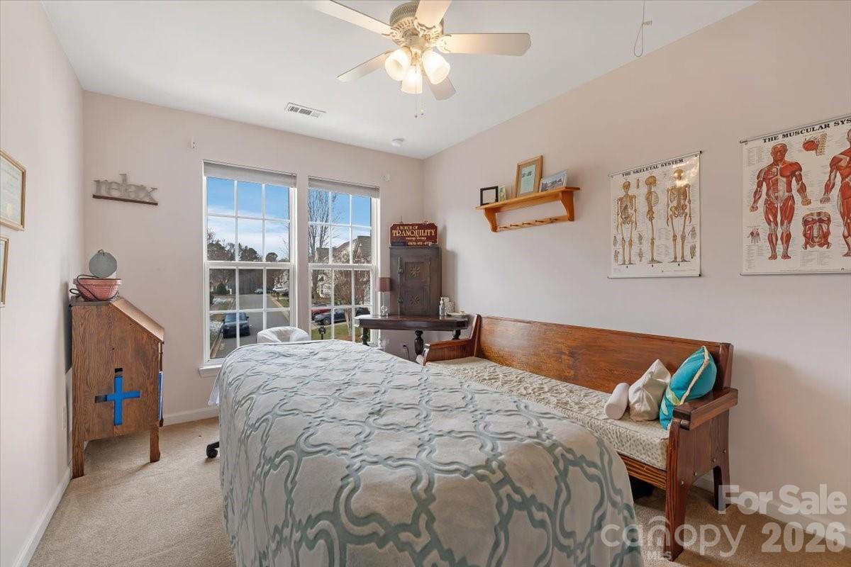 7948 Mariners Pointe Circle Denver, NC 28037 - Photo 28 of 39 a bedroom with bed and a window