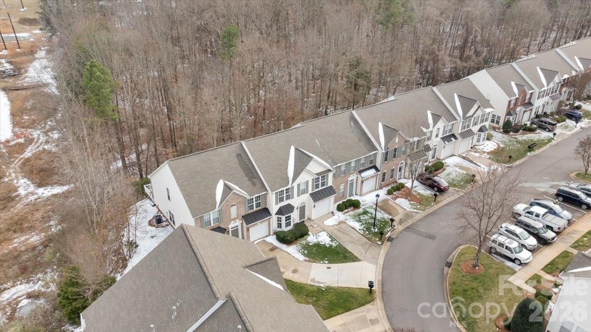 7948 Mariners Pointe Circle Denver, NC 28037 - Photo 3 of 39 an aerial view of a house with a yard and lake view
