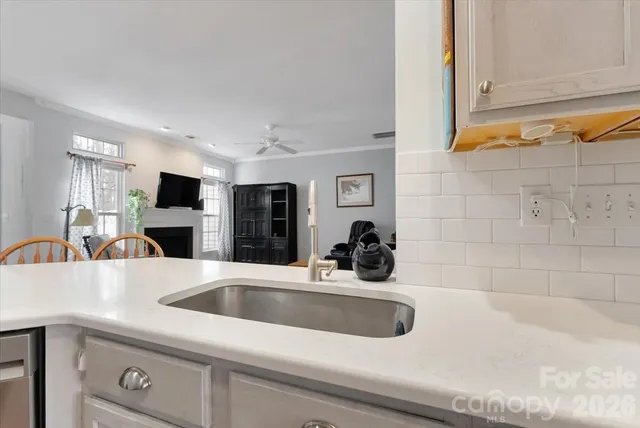 a kitchen with a sink and a refrigerator