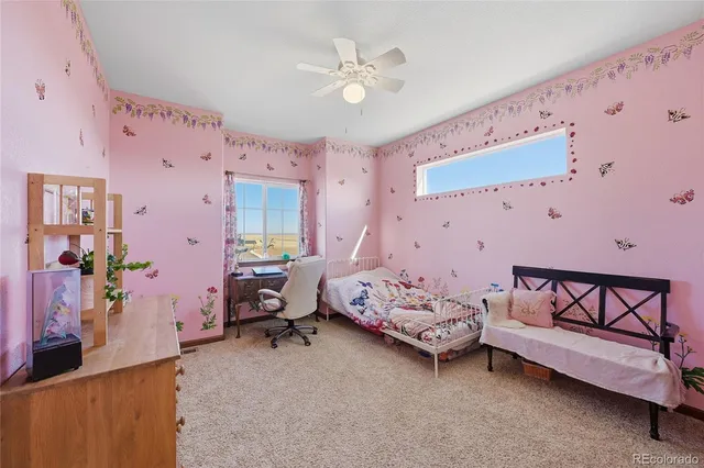 a bedroom with bed and a chandelier