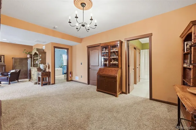 a view of a livingroom with a furniture and staircase
