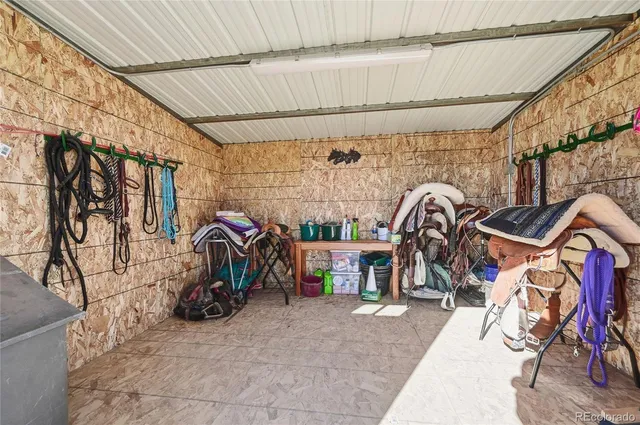 a view of a house with wooden deck and sitting area