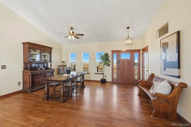 a view of a livingroom with furniture window and wooden floor