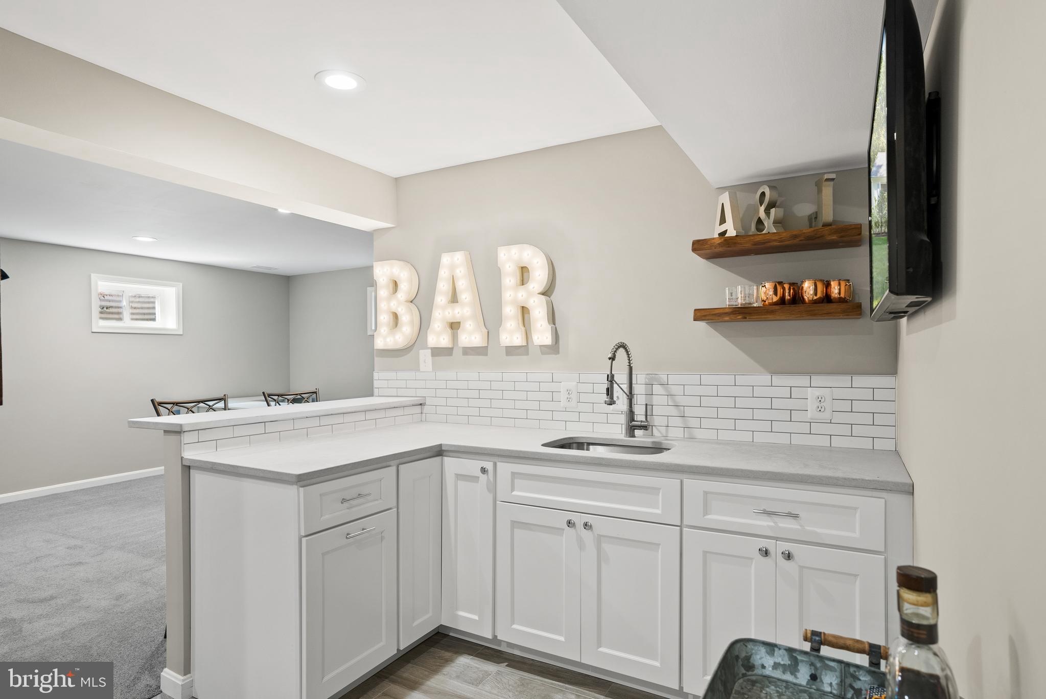 8436 Burning Tree Road Bethesda, MD 20817 - Photo 36 of 48 Full wetbar in the basement