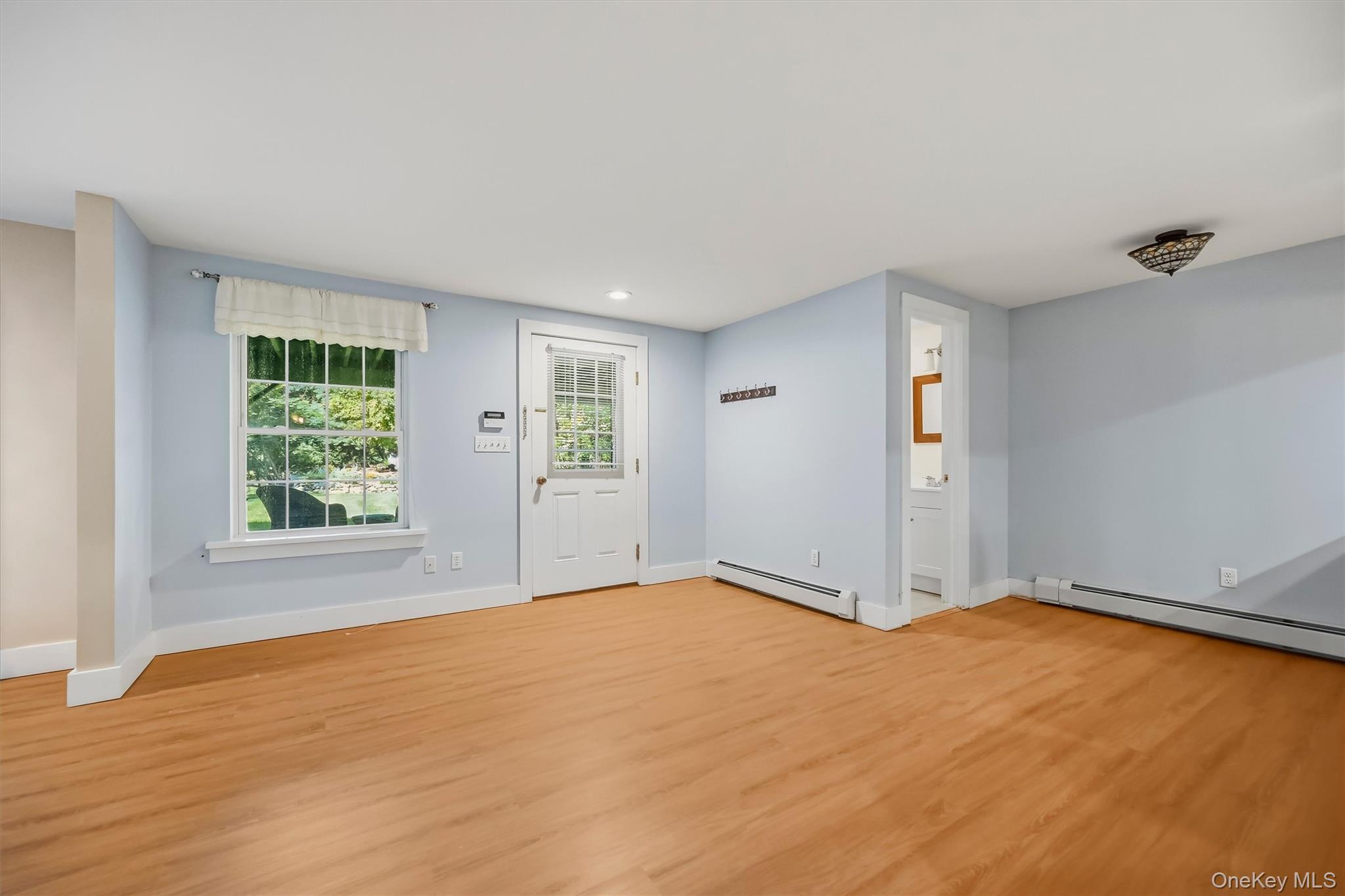 9 Short Road New Windsor, NY 12553 - Photo 31 of 48 Expansive finished lower level offers flexible space for entertaining, guests, or a home office, with easy walk-out access to the lakefront.