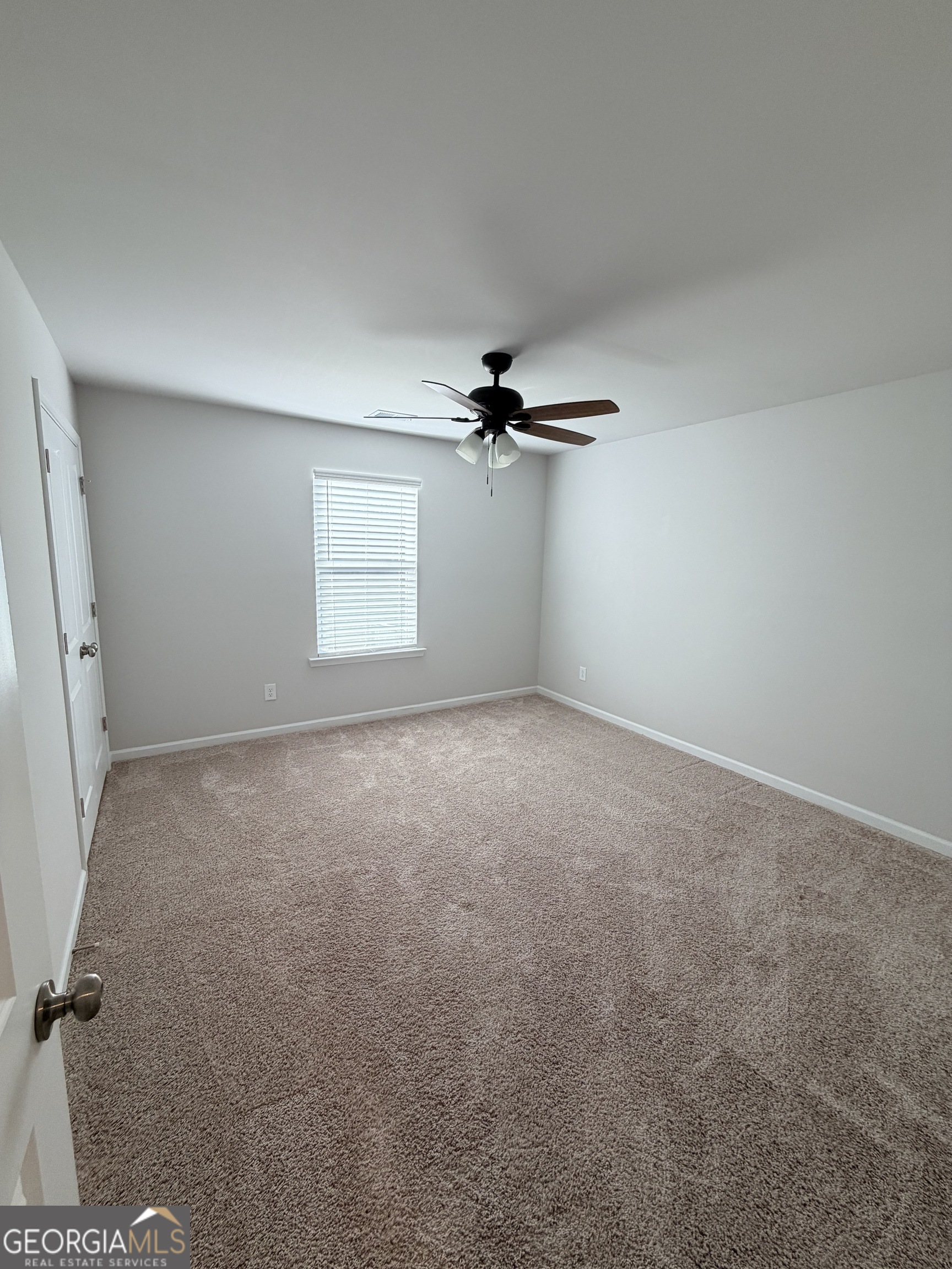 3283 Lowell Road Bethlehem, GA 30620 - Photo 21 of 31 a view of a livingroom with a ceiling fan and window