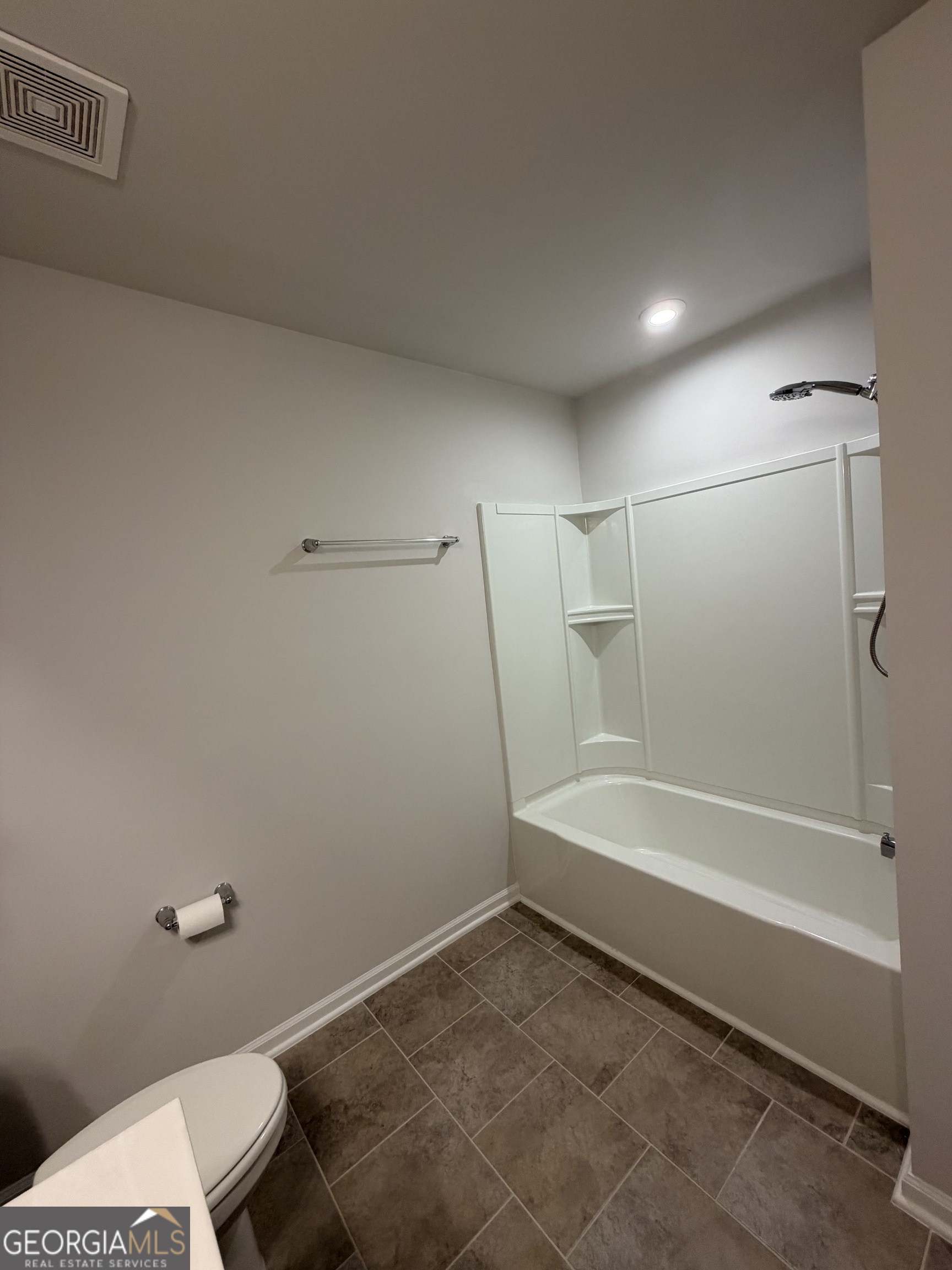 3283 Lowell Road Bethlehem, GA 30620 - Photo 22 of 31 a bathroom with a bathtub and a shower