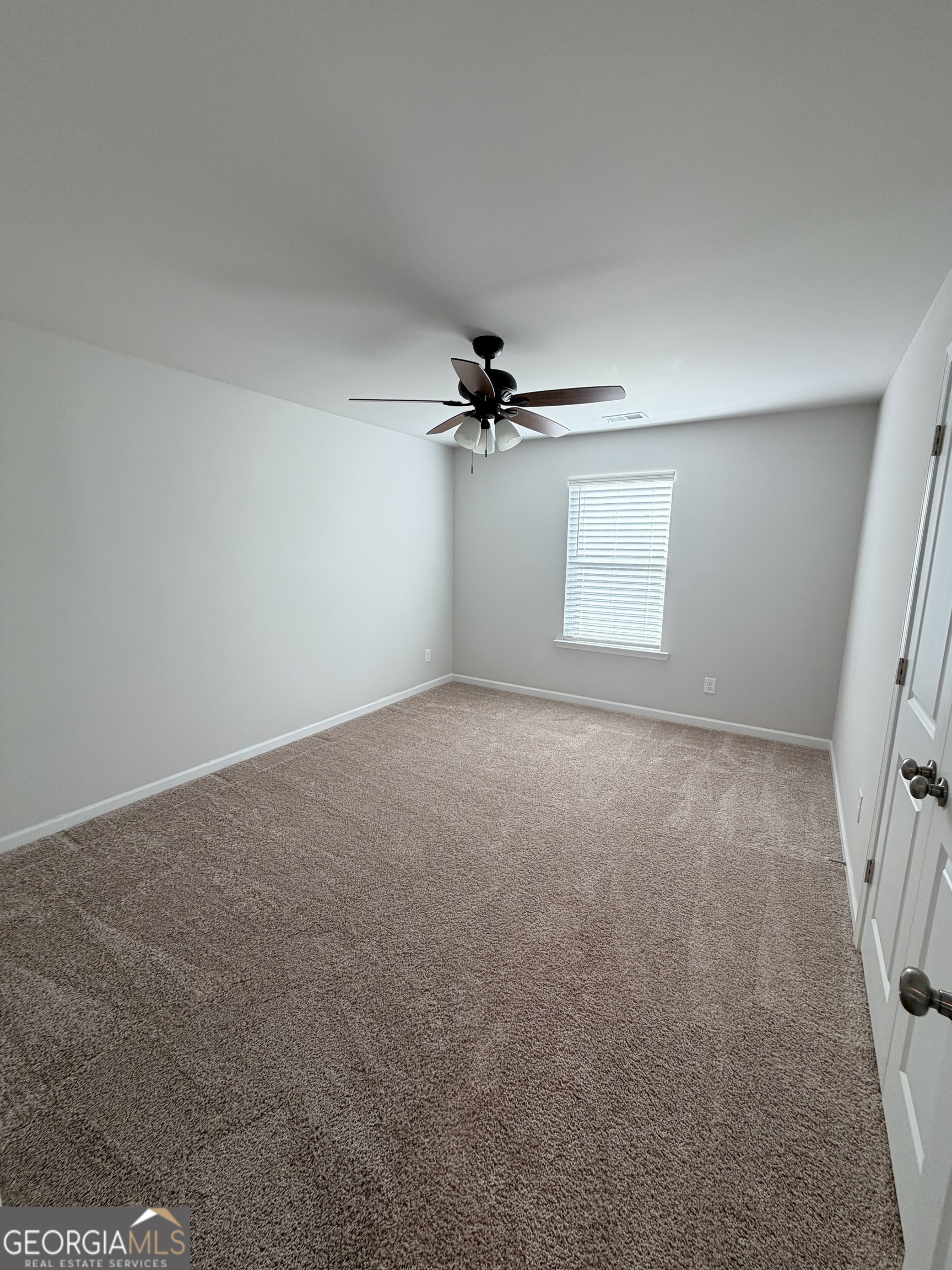 3283 Lowell Road Bethlehem, GA 30620 - Photo 23 of 31 a view of a livingroom with a ceiling fan and window