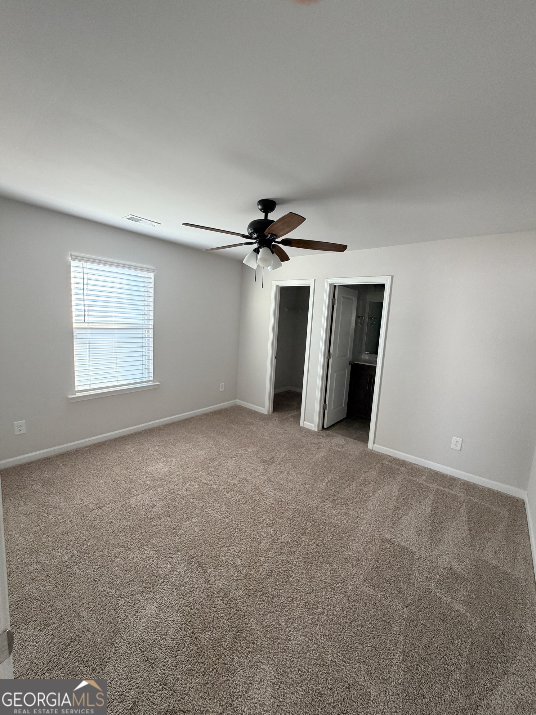 3283 Lowell Road Bethlehem, GA 30620 - Photo 27 of 31 a view of a livingroom with a ceiling fan and window