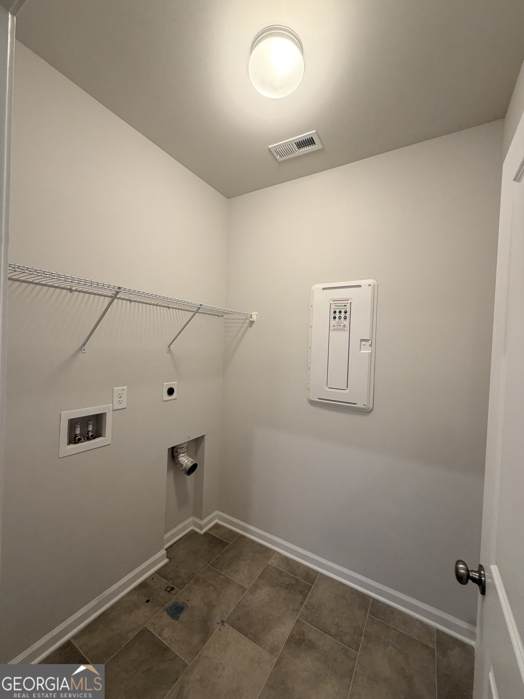 3283 Lowell Road Bethlehem, GA 30620 - Photo 29 of 31 a view of a room with racks on the wall