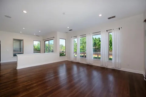 a en suite bathroom with a tub double sink and mirror