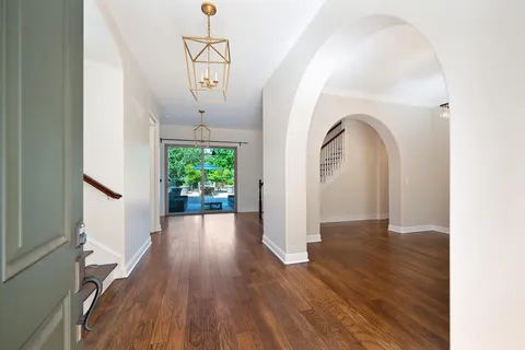 a view of kitchen with kitchen island and stainless steel appliances