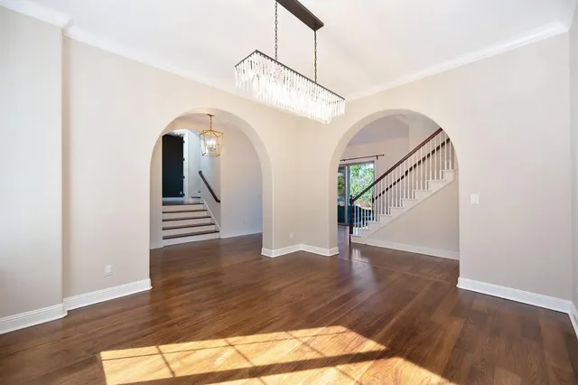 a view of kitchen with kitchen island and stainless steel appliances