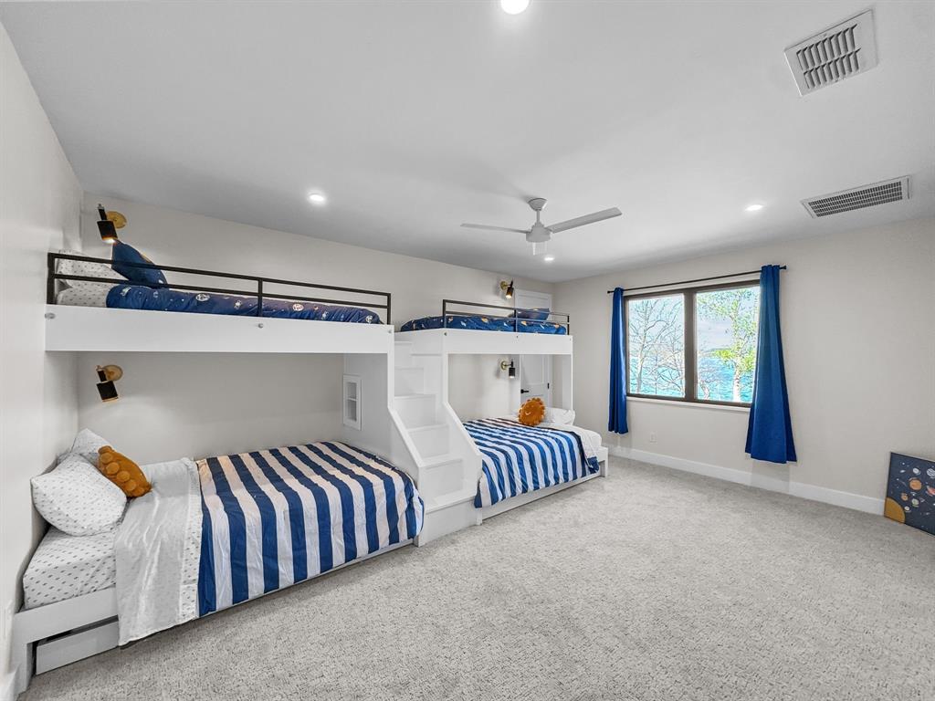 1163 Willow Road Graford, TX 76449 - Photo 17 of 31 a bed room with two beds and a window