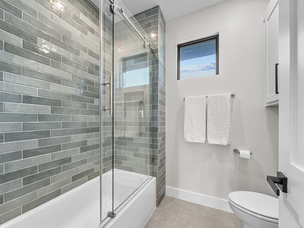 1163 Willow Road Graford, TX 76449 - Photo 18 of 31 a bathroom with a bathtub and shower